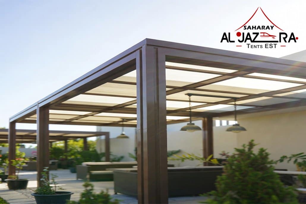 Modern aluminum pergola with retractable beige fabric canopy providing elegant shade in a sunny outdoor patio